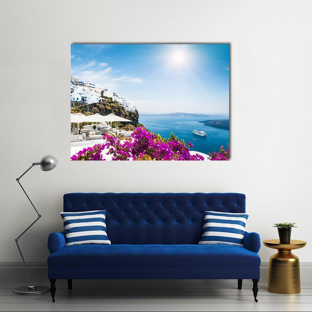 White Architecture on Santorini Island Canvas Wall Art in white, blue and purple, single panel hung on a wall