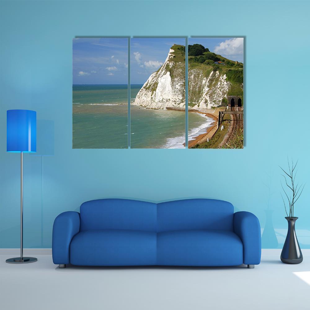 White Chalk Cliffs by the Sea Canvas Wall Art in white, green and blue, 3 panel horizontal set hung on a wall