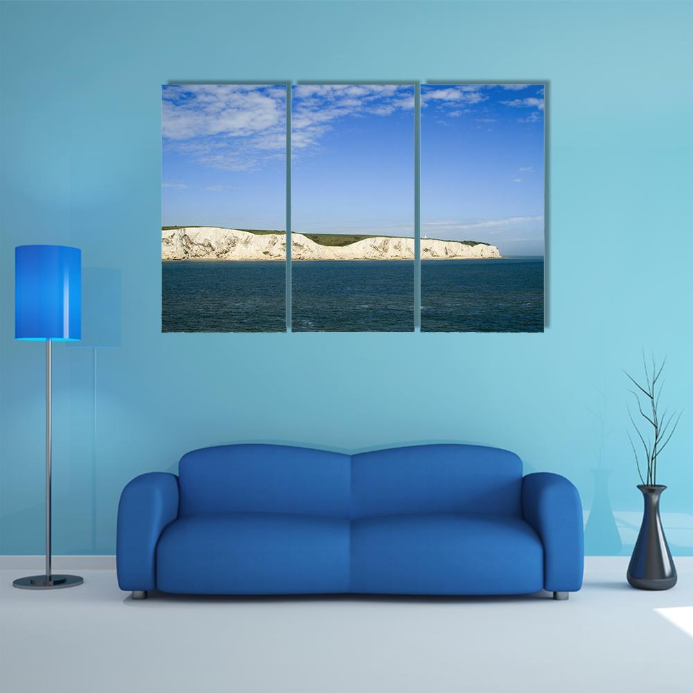 White Cliffs of Dover from the Sea Canvas Wall Art in white, blue and navy, 3 panel horizontal set hung on a wall