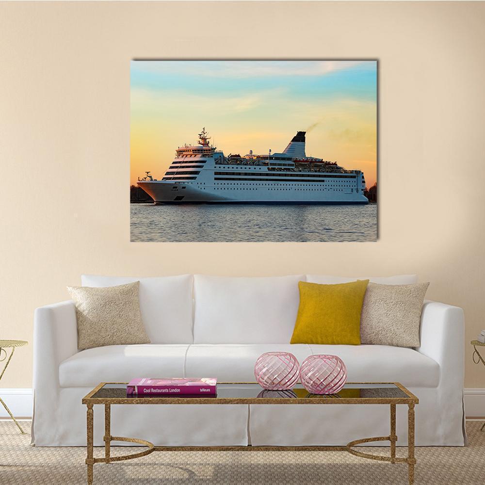 White Passenger Ship at Sunset Canvas Wall Art in orange, yellow and blue, single panel hung on a wall