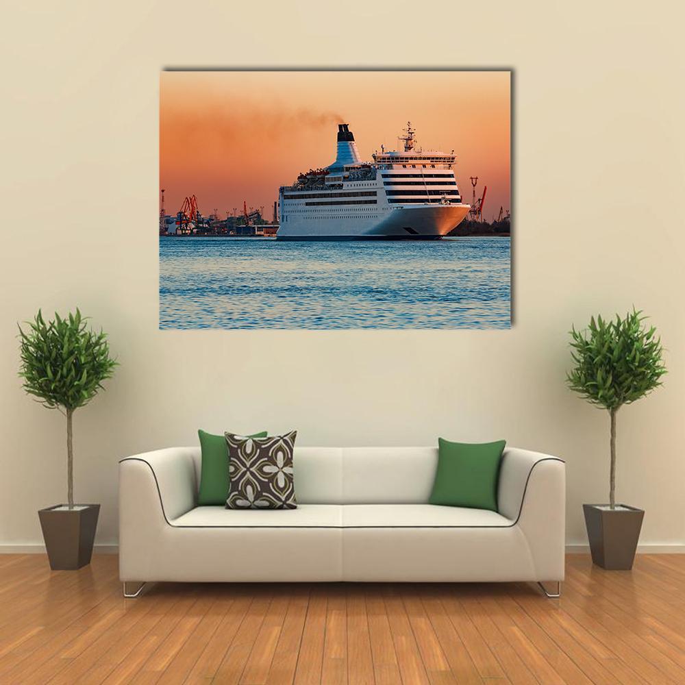 White Passenger Ship at Sunset Canvas Wall Art in white, orange and blue, single panel hung on a wall