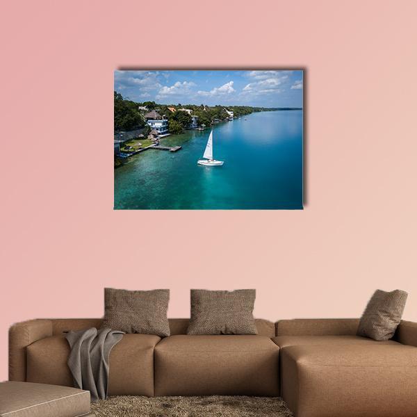 White Sailing Yacht in Mexico Canvas Wall Art in green and blue, single panel hung on a wall