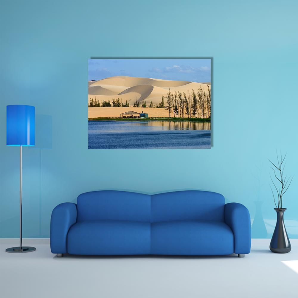 Mui Ne White Sand Dune with Oasis Canvas Wall Art in beige, yellow and blue, single panel hung on a wall