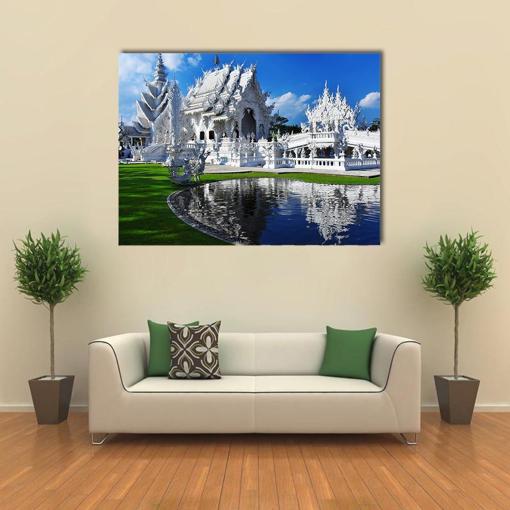 White Temple in Chiang Rai Canvas Wall Art in white, green and blue, single panel hung on a wall