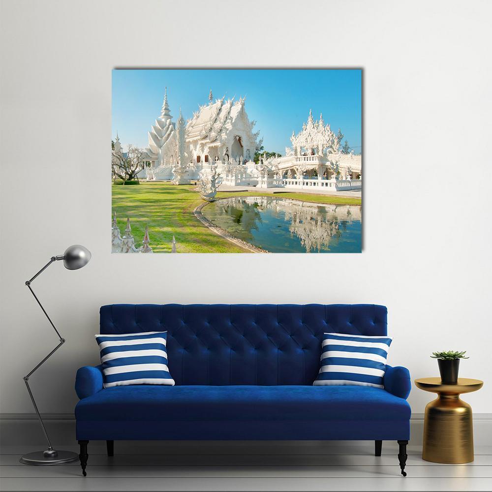 Ornate White Temple in Chiang Rai Canvas Wall Art in white, green and blue, single panel hung on a wall