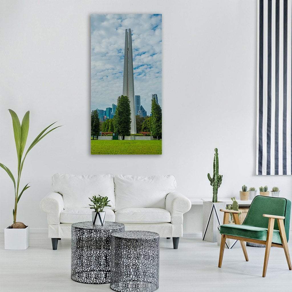 White Four-column Obelisk in Singapore Vertical Canvas Wall Art in white, green and blue, single vertical panel hung on a wall