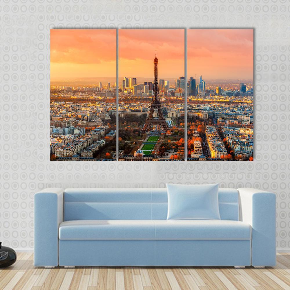 Paris Twilight View Canvas Wall Art in orange, yellow and blue, single panel hung on a wall