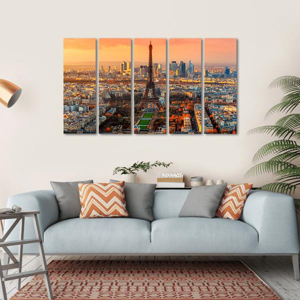 Eiffel Tower at Twilight, Paris Skyline Canvas Wall Art in gray, orange and yellow, hung on a wall