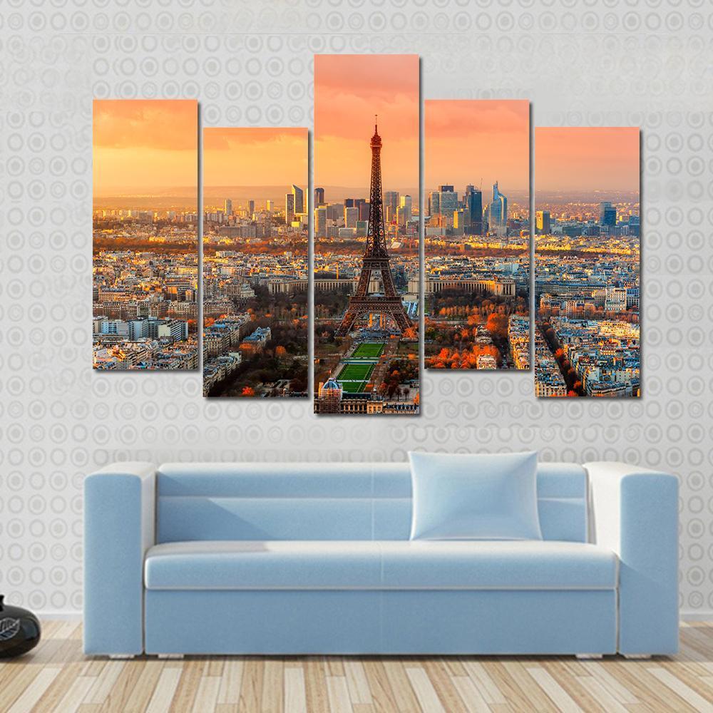 Paris Twilight View Canvas Wall Art in orange, yellow and blue, 5 panel Pop layout hung on a wall