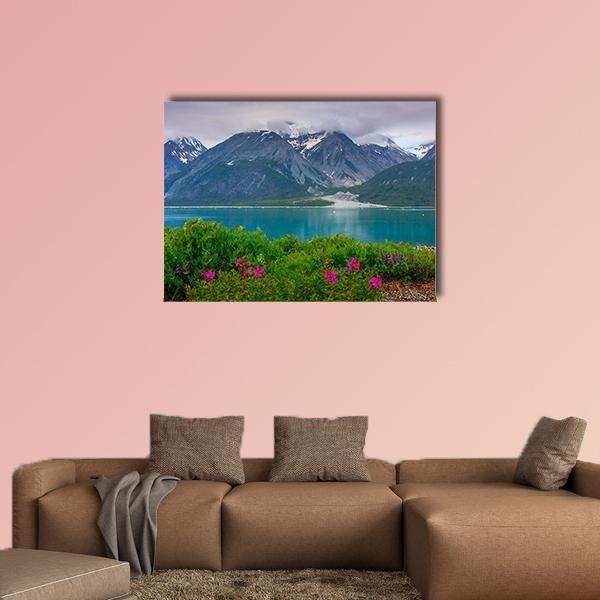 Glacier Bay Wildflowers and Snow-capped Mountains Canvas Wall Art in gray, green and blue, single panel hung on a wall