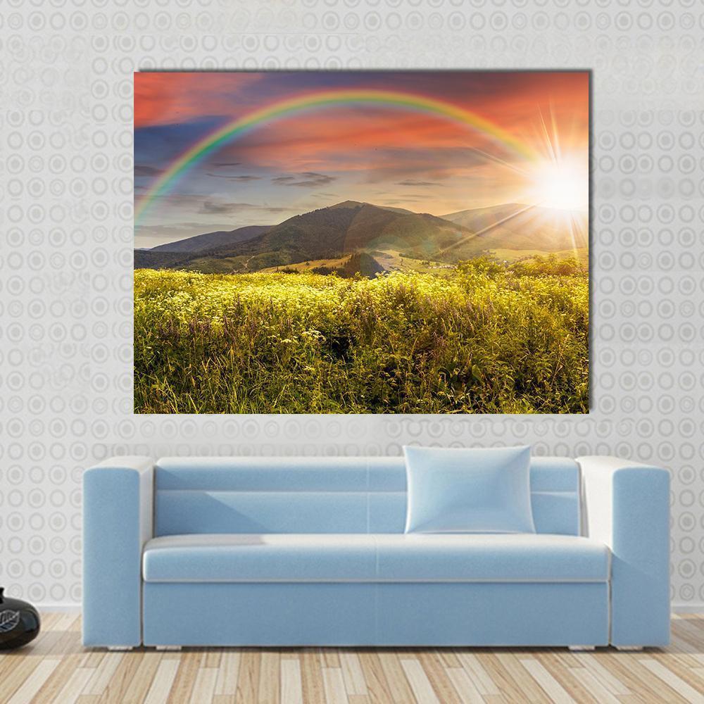 Rainbow Over Wildflower Meadow and Mountains Canvas Wall Art in orange, yellow and green, single panel hung on a wall