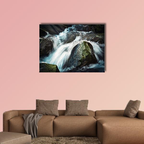 Wild River Between Stones Canvas Wall Art in black, white and blue, single panel hung on a wall
