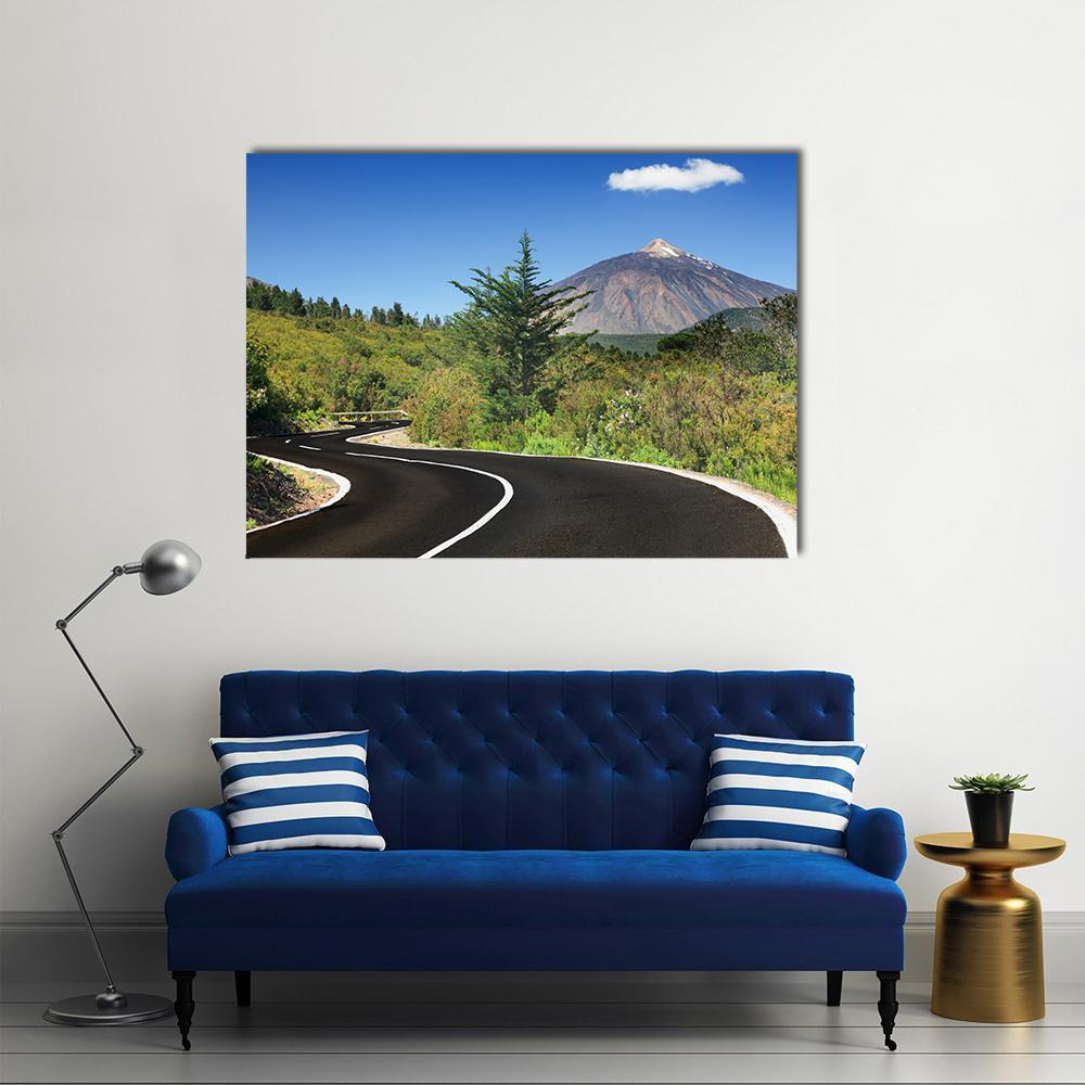 Winding Mountain Road Canvas Wall Art in black, green and blue, single panel hung on a wall
