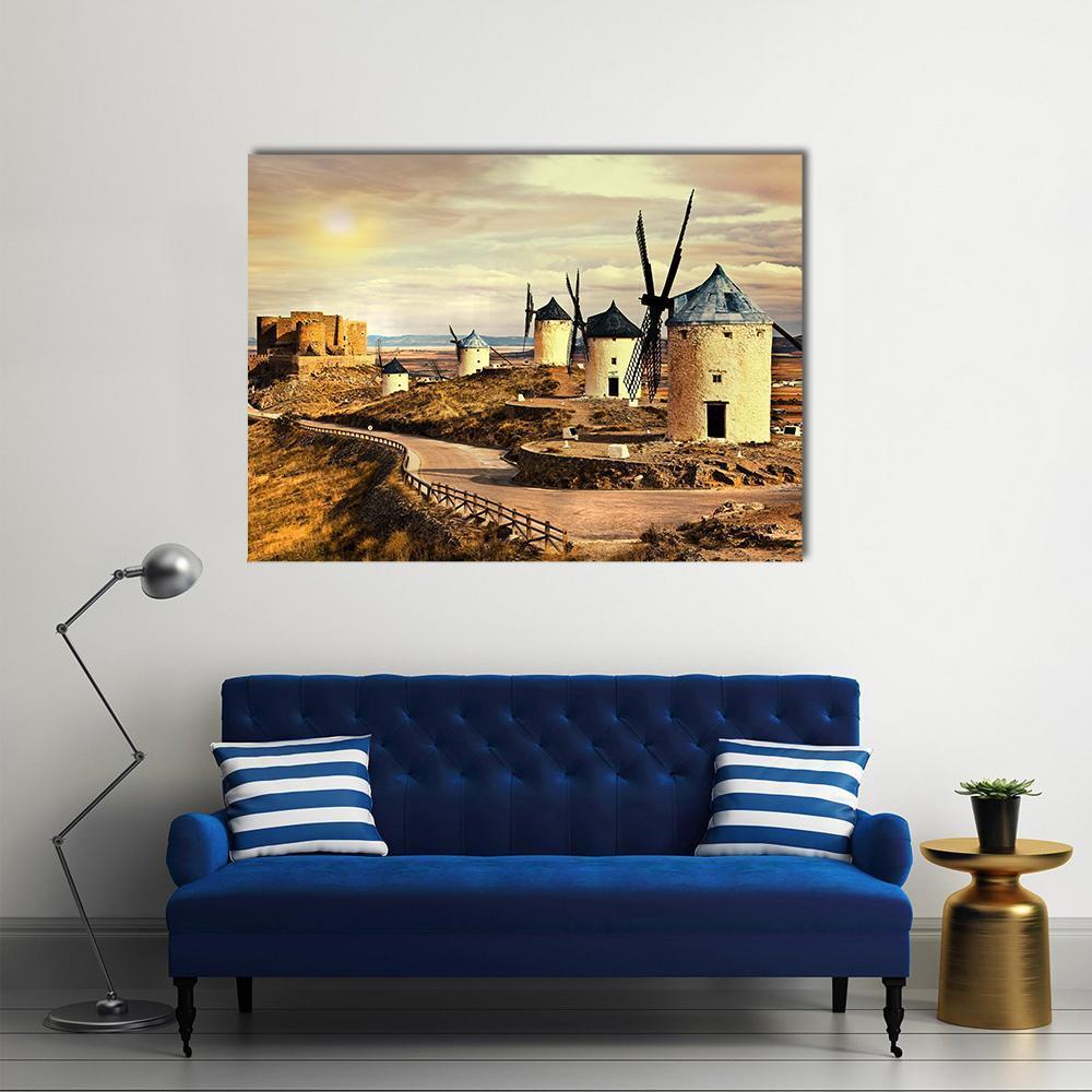 Spanish Windmills at Sunset Canvas Wall Art in beige, brown and yellow, single panel hung on a wall