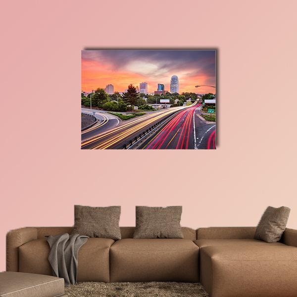 Winston Salem Light Trails at Sunset Canvas Wall Art in orange, yellow and purple, single panel hung on a wall