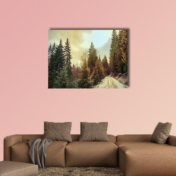 Snowy Forest Road in Winter Canvas Wall Art in white, brown and green, single panel hung on a wall