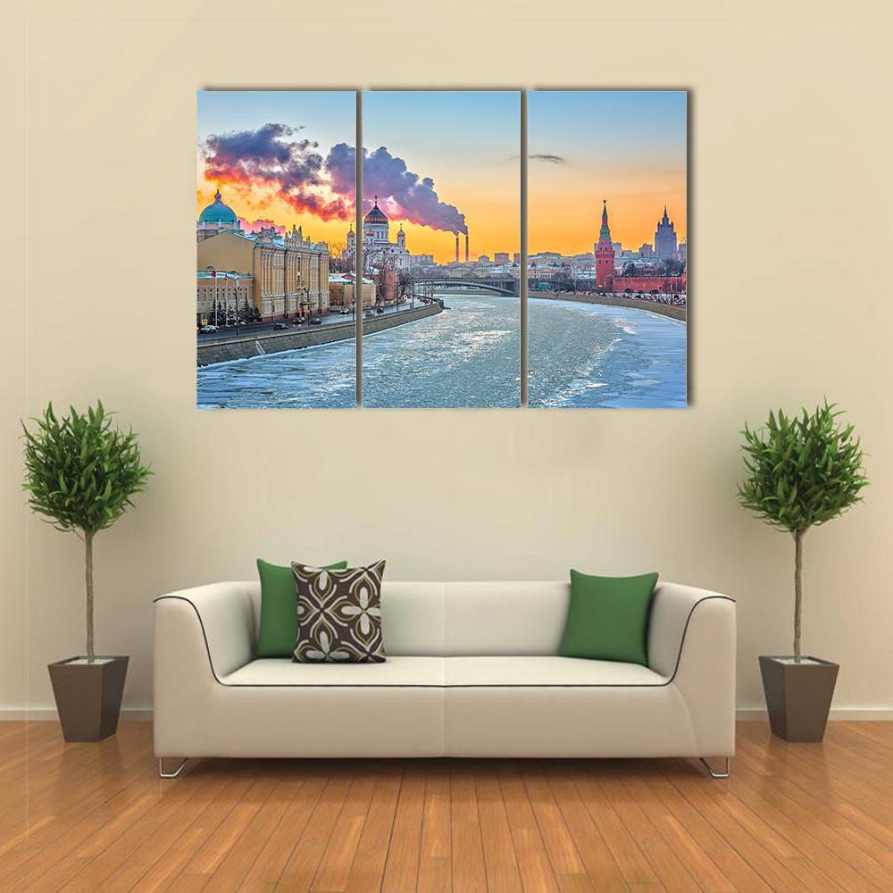 Winter Evening in Moscow Canvas Wall Art in orange, yellow and blue, 3 panel horizontal set hung on a wall