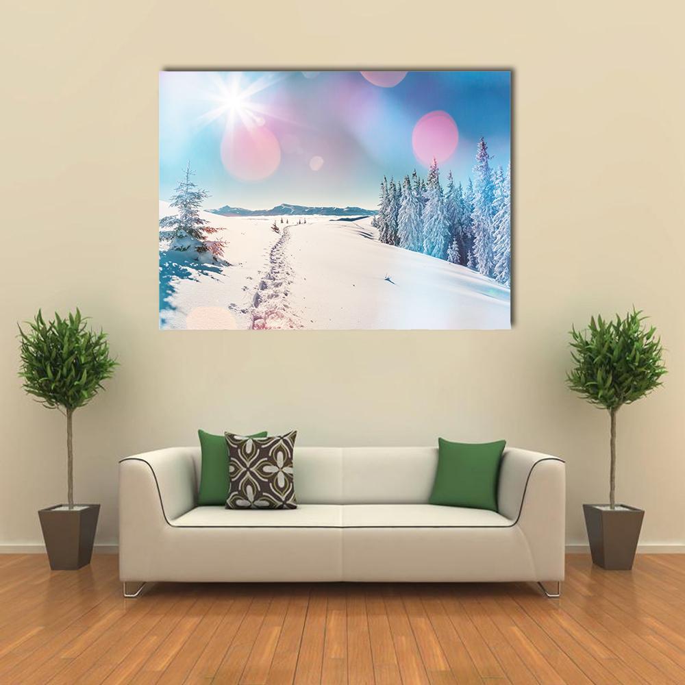 Snowy Path Glowing in Winter Light Canvas Wall Art in white, blue and pink, single panel hung on a wall