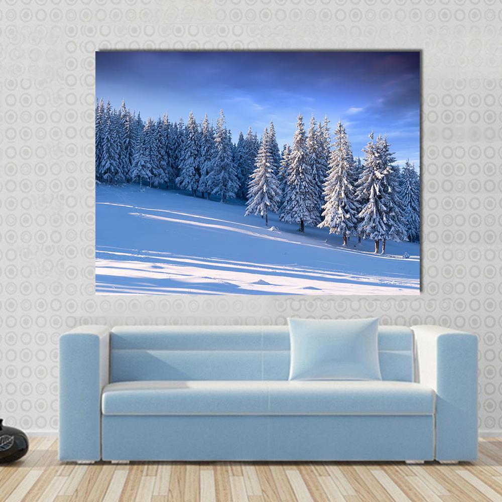 Winter Landscape in Forest Canvas Wall Art in white and blue, single panel hung on a wall