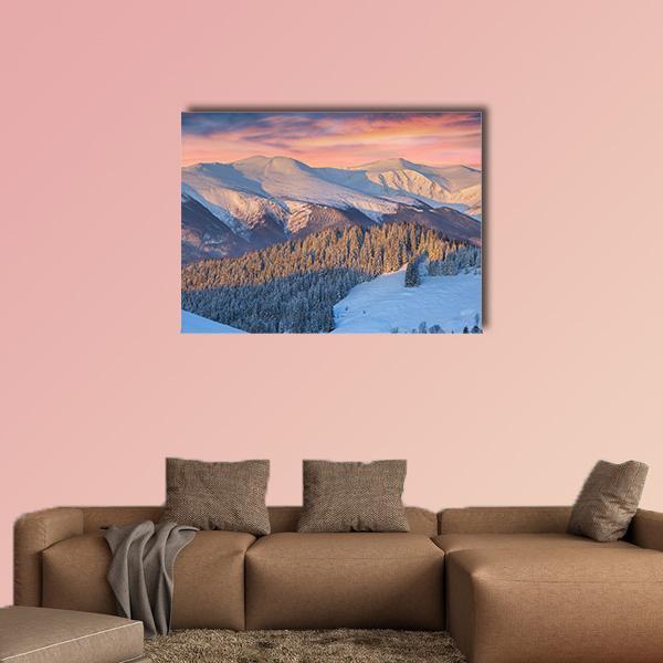 Snow-covered Mountain Sunrise Canvas Wall Art in white, blue and pink, single panel hung on a wall