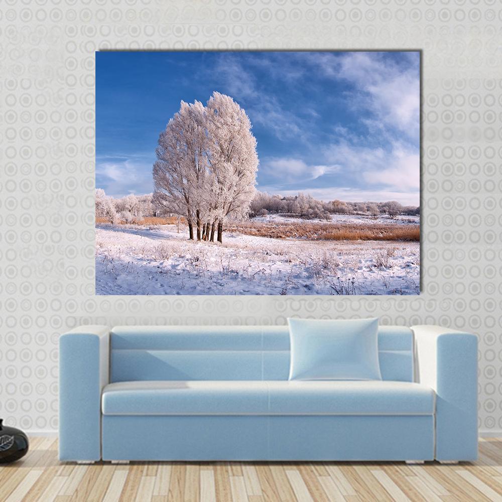 Frozen Tree in Winter Landscape Canvas Wall Art in white and blue, single panel hung on a wall