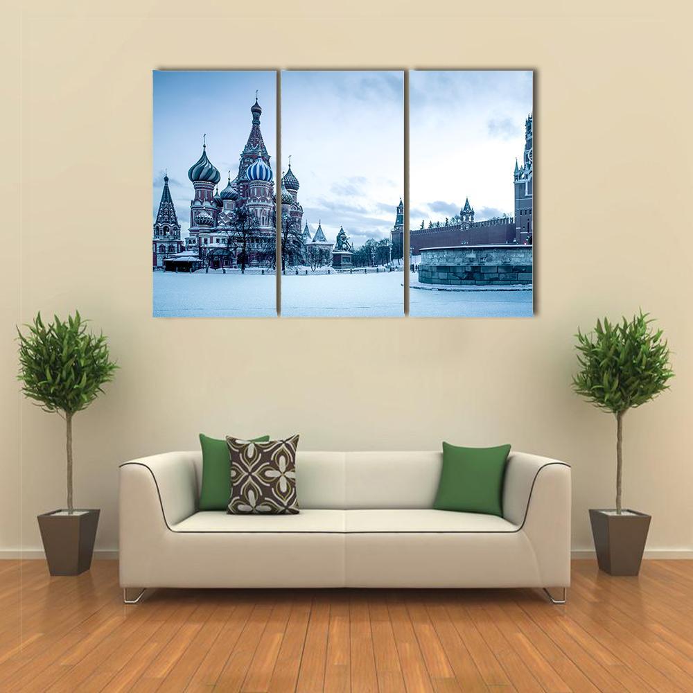 Saint Basil's Cathedral in Winter Canvas Wall Art in white and blue, 3 panel horizontal set hung on a wall