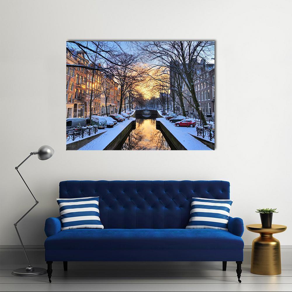 Amsterdam Winter Canal at Sunset Canvas Wall Art in white, orange and blue, single panel hung on a wall