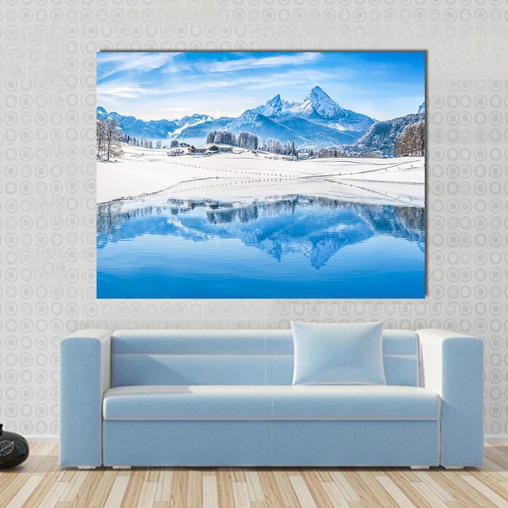 Winter Wonderland Scenery in the Alps with Snowy Mountain Canvas Wall Art in white and blue, single panel hung on a wall