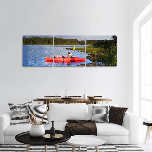 Woman Canoeing In A Lake Panoramic Canvas Wall Art-3 Piece-25&quot; x 08&quot;-Tiaracle