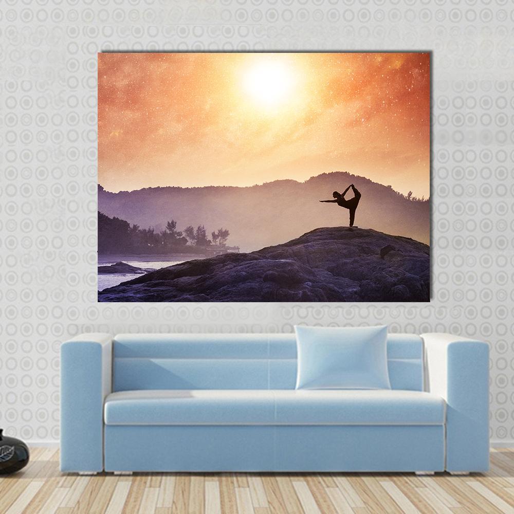 Woman in Natarajasana at Sunset Canvas Wall Art in orange, yellow and purple, single panel hung on a wall