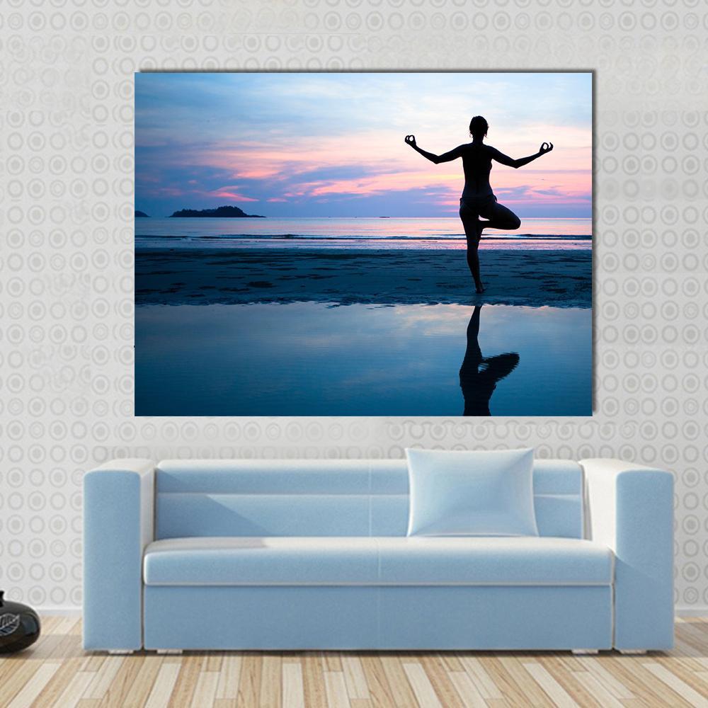 Yoga Silhouette on Beach at Sunset Canvas Wall Art in black, blue and pink, single panel hung on a wall