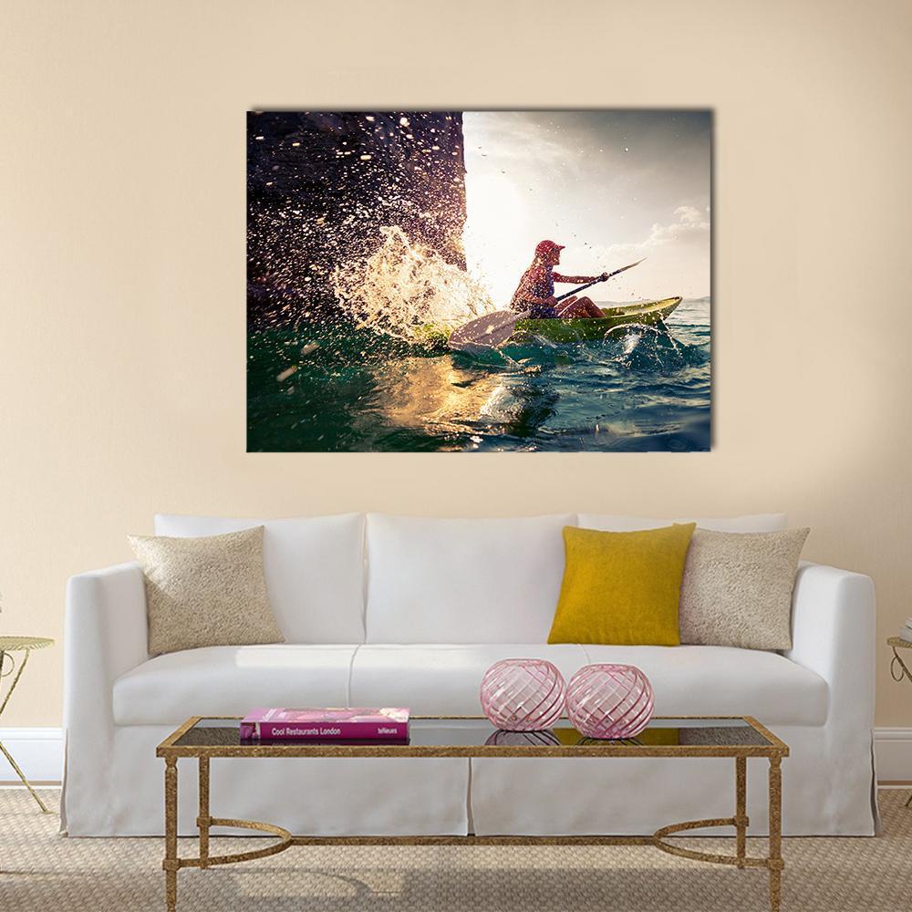Woman in Green Kayak by Cliff Canvas Wall Art in brown, green and blue, single panel hung on a wall