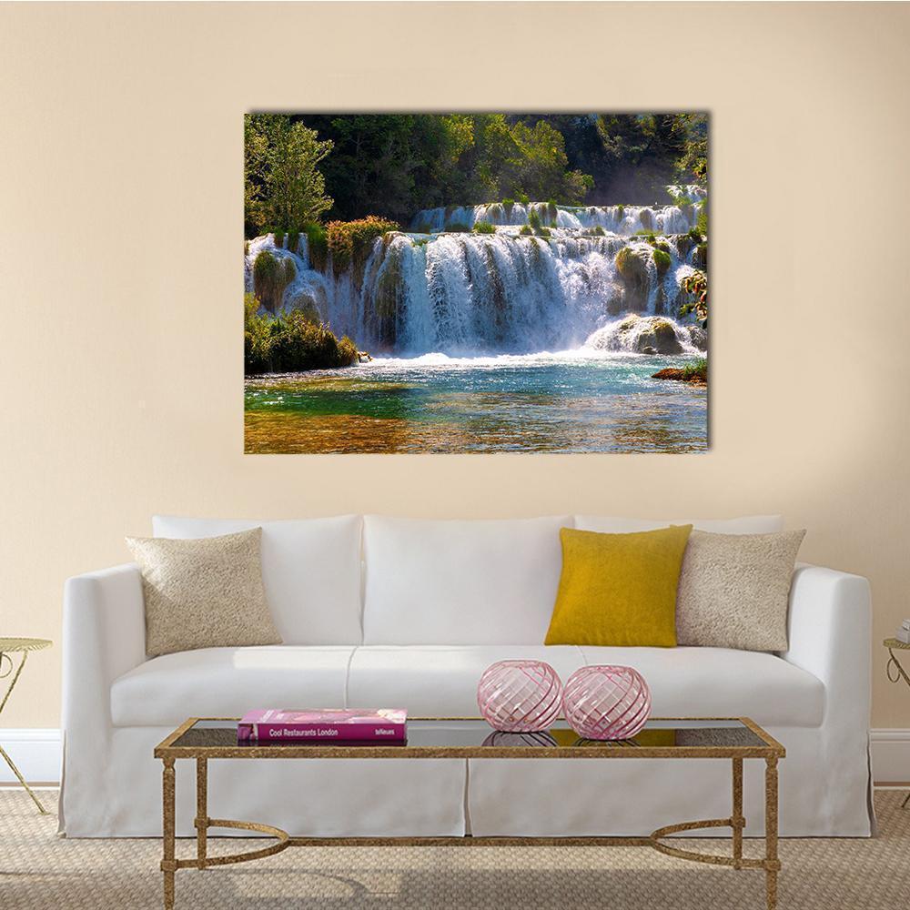Multi-level Waterfalls with River and Forest Canvas Wall Art in white, green and blue, single panel hung on a wall