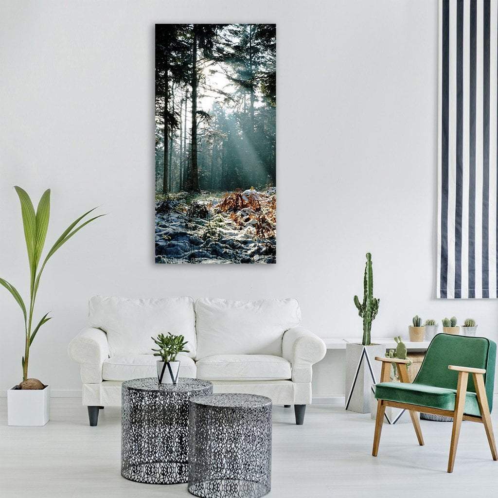 Sunbeams in a Snowy Forest Vertical Canvas Wall Art in black, white and green, single vertical panel hung on a wall