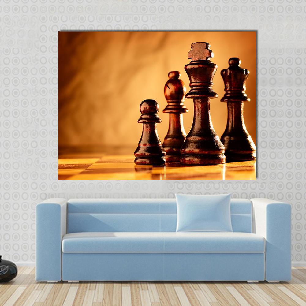Wooden Chess Pieces on Board Canvas Wall Art in brown, gold and orange, single panel hung on a wall