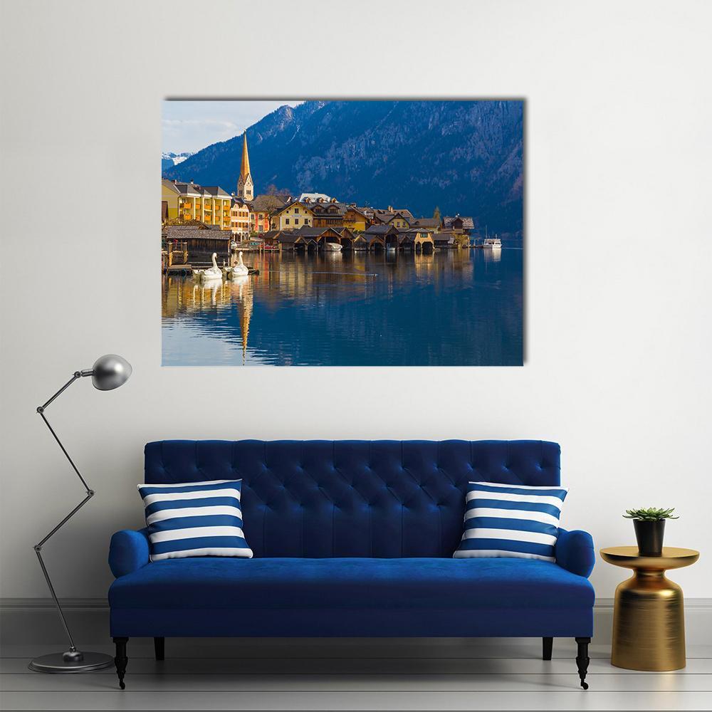 Wooden Houses of Hallstatt on Serene Lake Canvas Wall Art in brown, yellow and blue, single panel hung on a wall