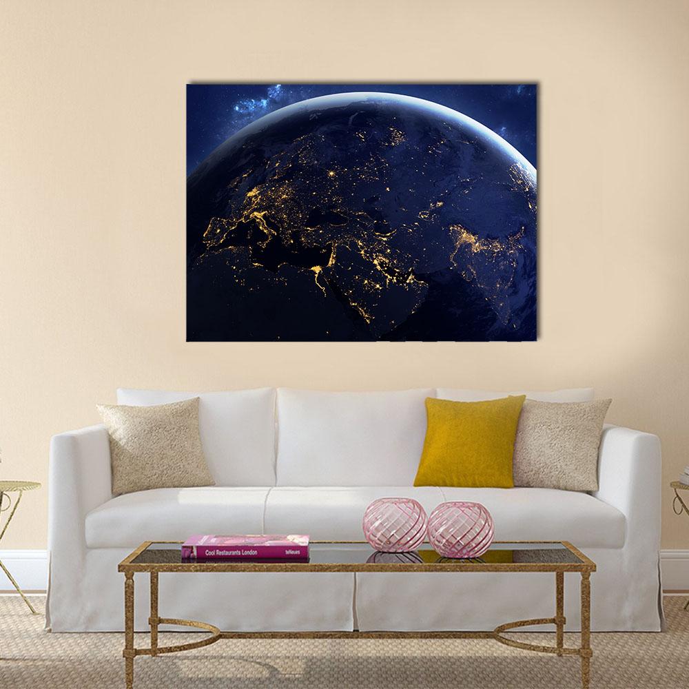 Earth at Night with Mediterranean Lights Canvas Wall Art in black, gold and blue, single panel hung on a wall