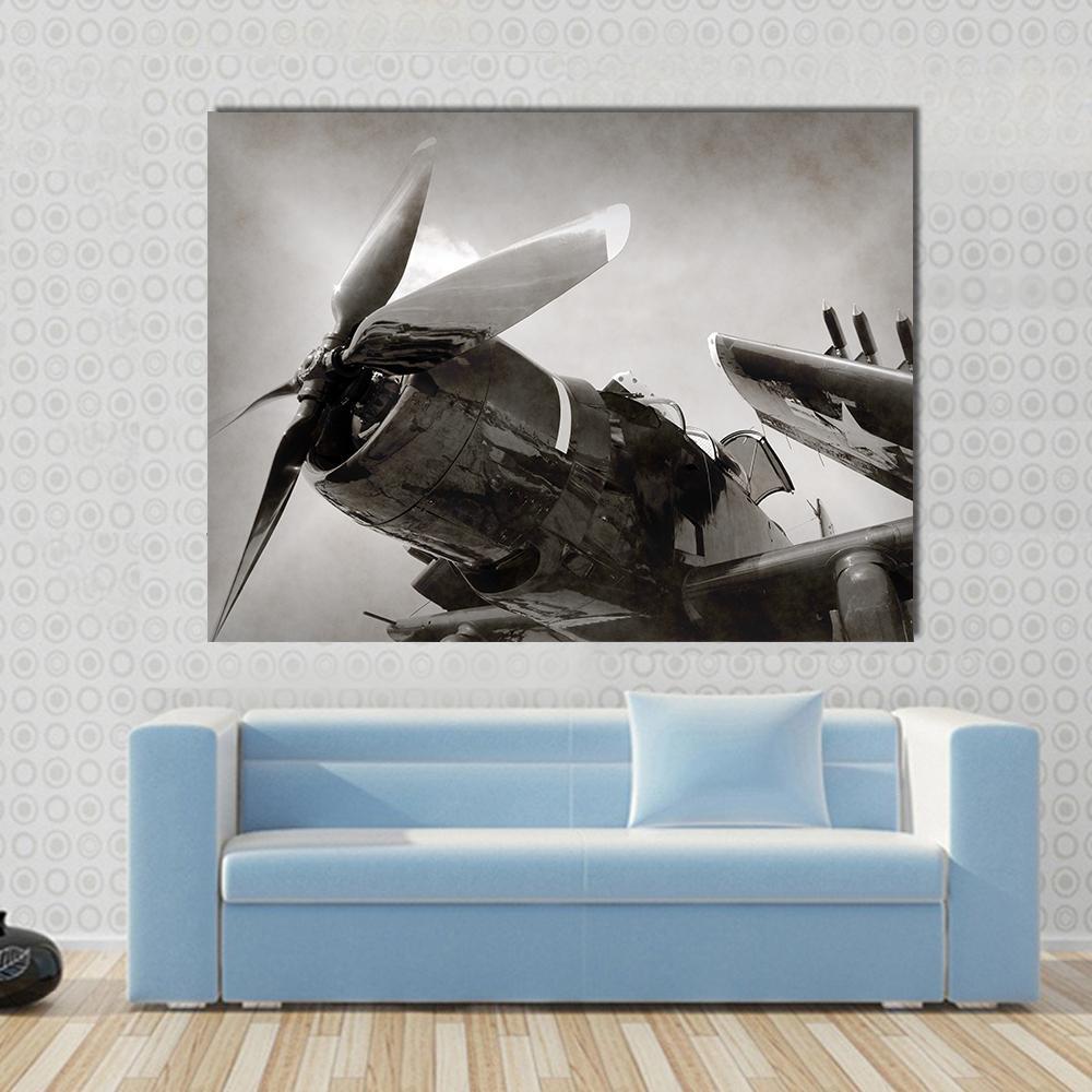 World War Ii Navy Fighter Plane with Folded Wings Canvas Wall Art in black, gray and beige, single panel hung on a wall