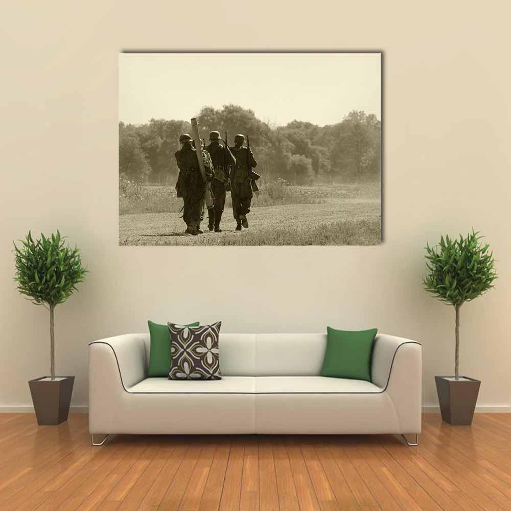 World War Ii Soldiers in Rural Field Canvas Wall Art in gray, beige and brown, single panel hung on a wall