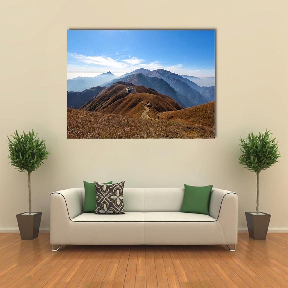 Wugong Mountain Trekking Canvas Wall Art in beige, brown and blue, single panel hung on a wall