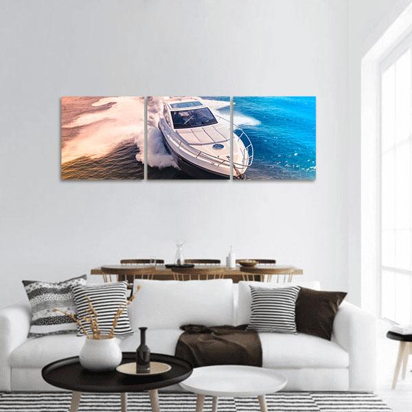White Motor Yacht in Deep Blue Water Panoramic Canvas Wall Art in white and blue, hung on a wall