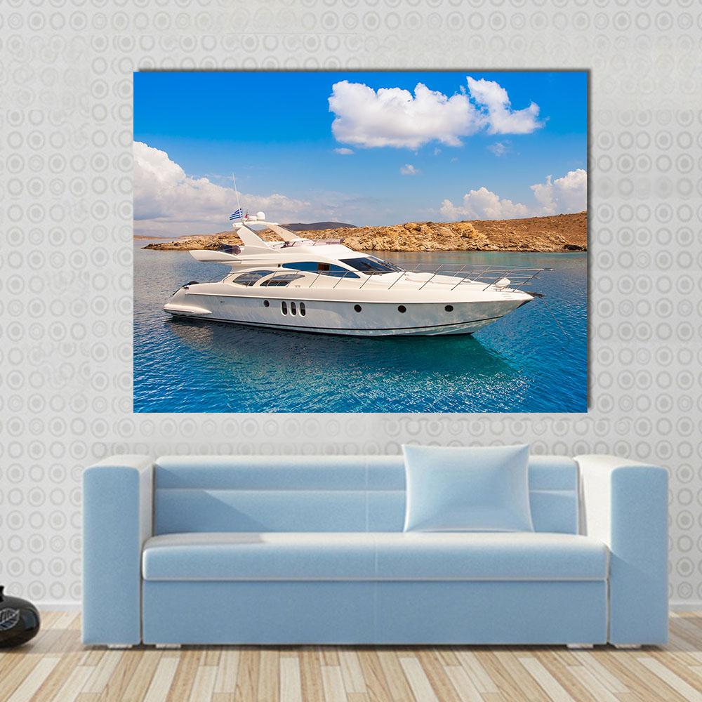 White Yacht Off Rocky Island Coast with Greek Flag Canvas Wall Art in white, brown and blue, single panel hung on a wall
