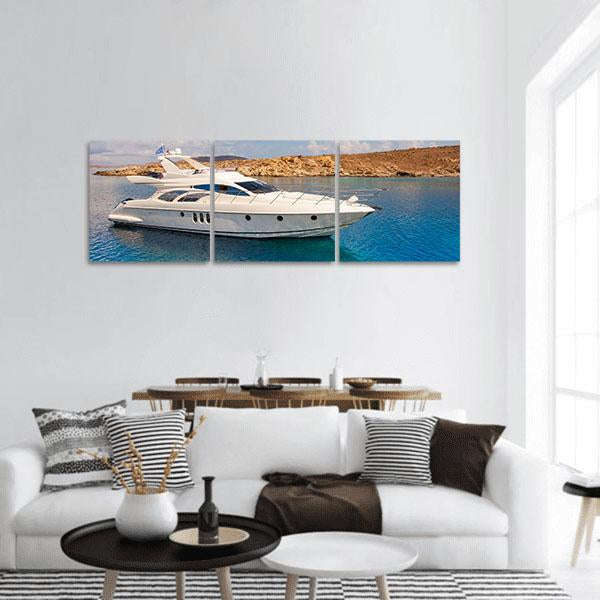 Luxury Yacht Near Rugged Coastline Panoramic Canvas Wall Art in white, brown and blue, hung on a wall