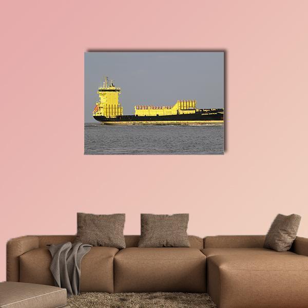 Yellow Container Ship at Sea Canvas Wall Art in gray, yellow and blue, single panel hung on a wall