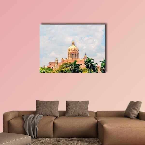 Cuban Capitol Dome with Flag and Palm Trees Canvas Wall Art in beige, green and blue, single panel hung on a wall