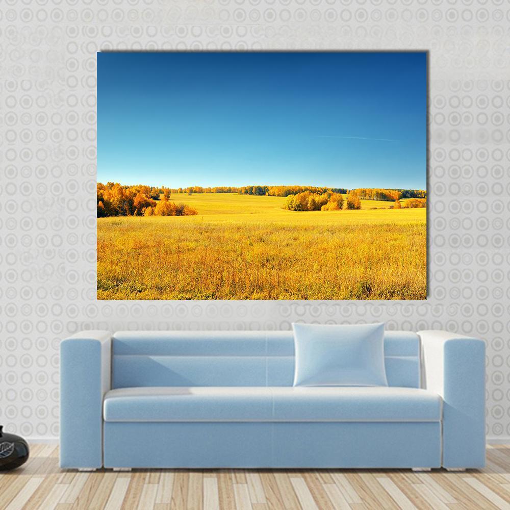 Yellow Field and Blue Sky Canvas Wall Art in yellow and blue, single panel hung on a wall