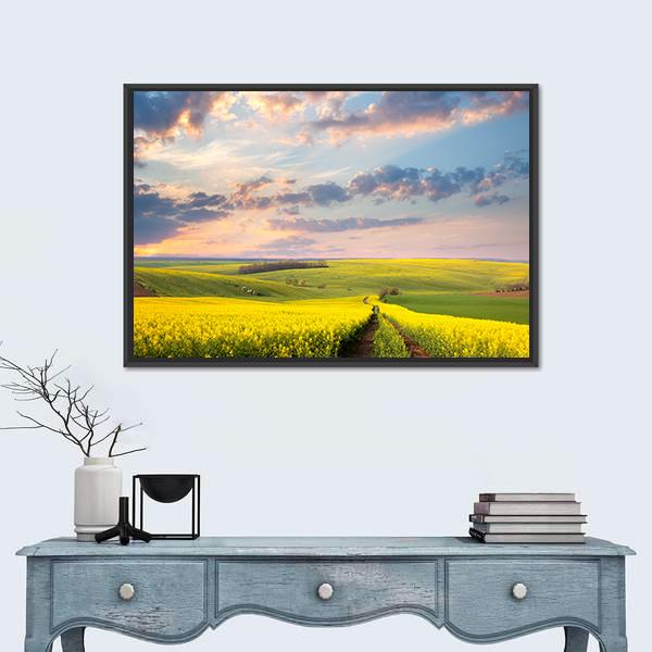 Field of Yellow Flowers with Winding Path Canvas Wall Art in yellow, green and blue, framed canvas, product view on a white background