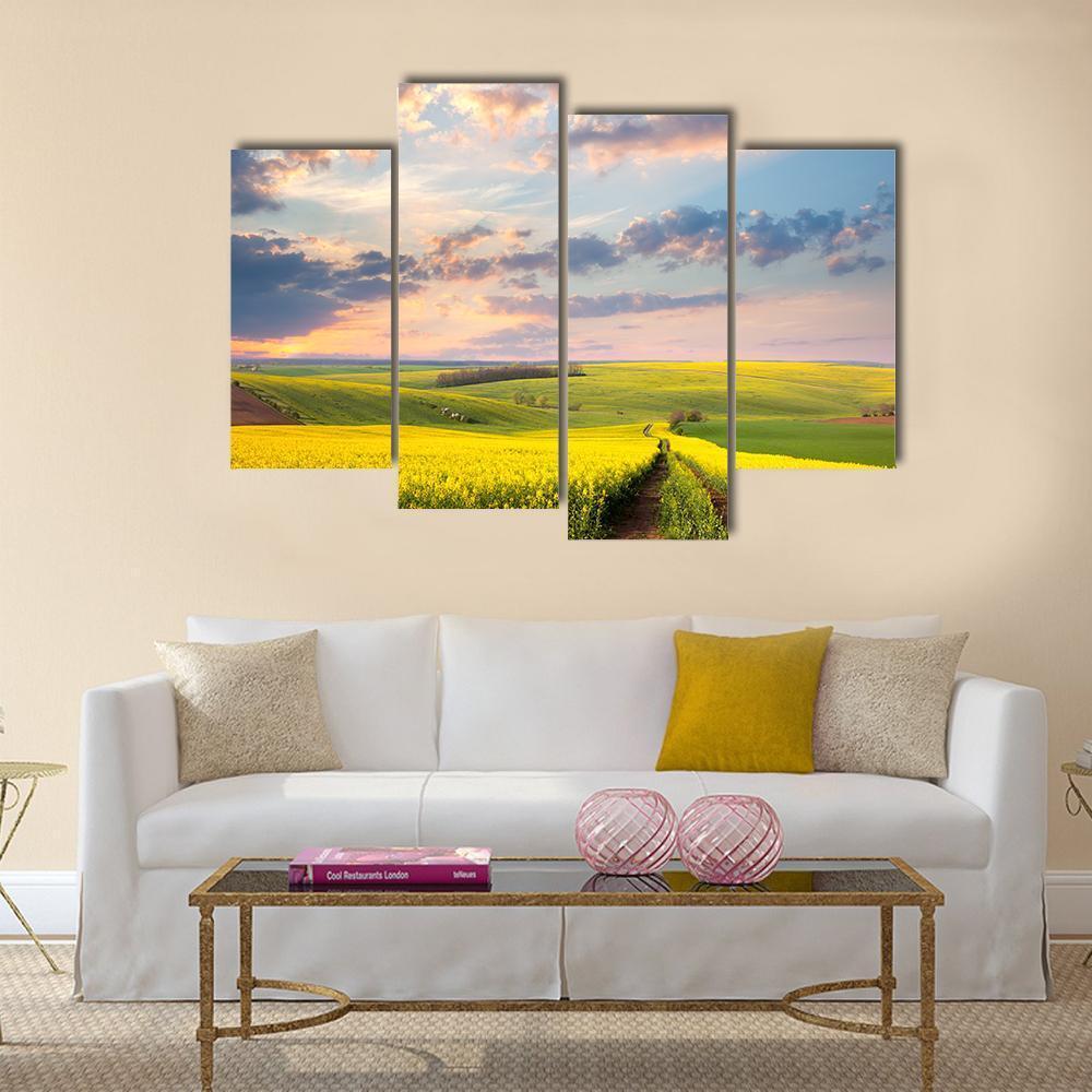 Field of Yellow Flowers with Winding Path Canvas Wall Art in yellow, green and blue, single panel hung on a wall