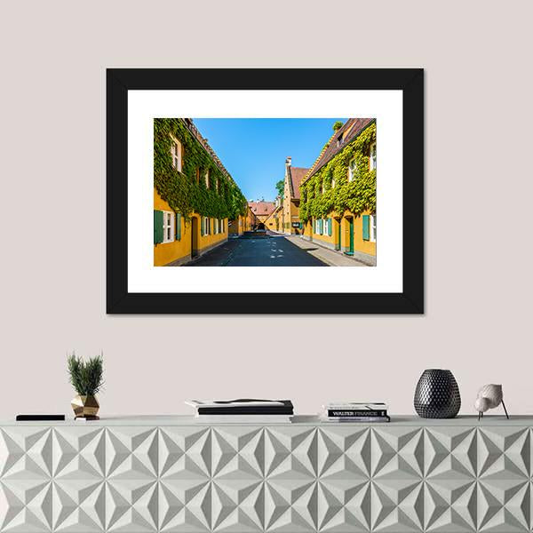 Yellow Walls In The Fuggerei Canvas Wall Art-1 Piece-Framed Print-20" x 16"-Tiaracle