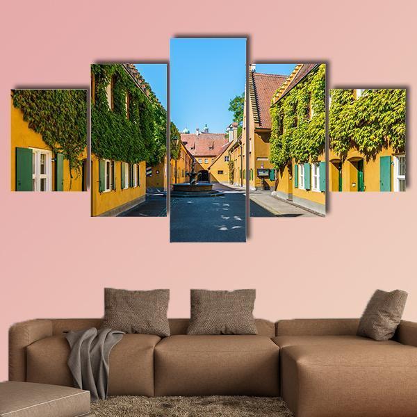 Yellow Walls In The Fuggerei Canvas Wall Art-5 Star-Gallery Wrap-62" x 32"-Tiaracle